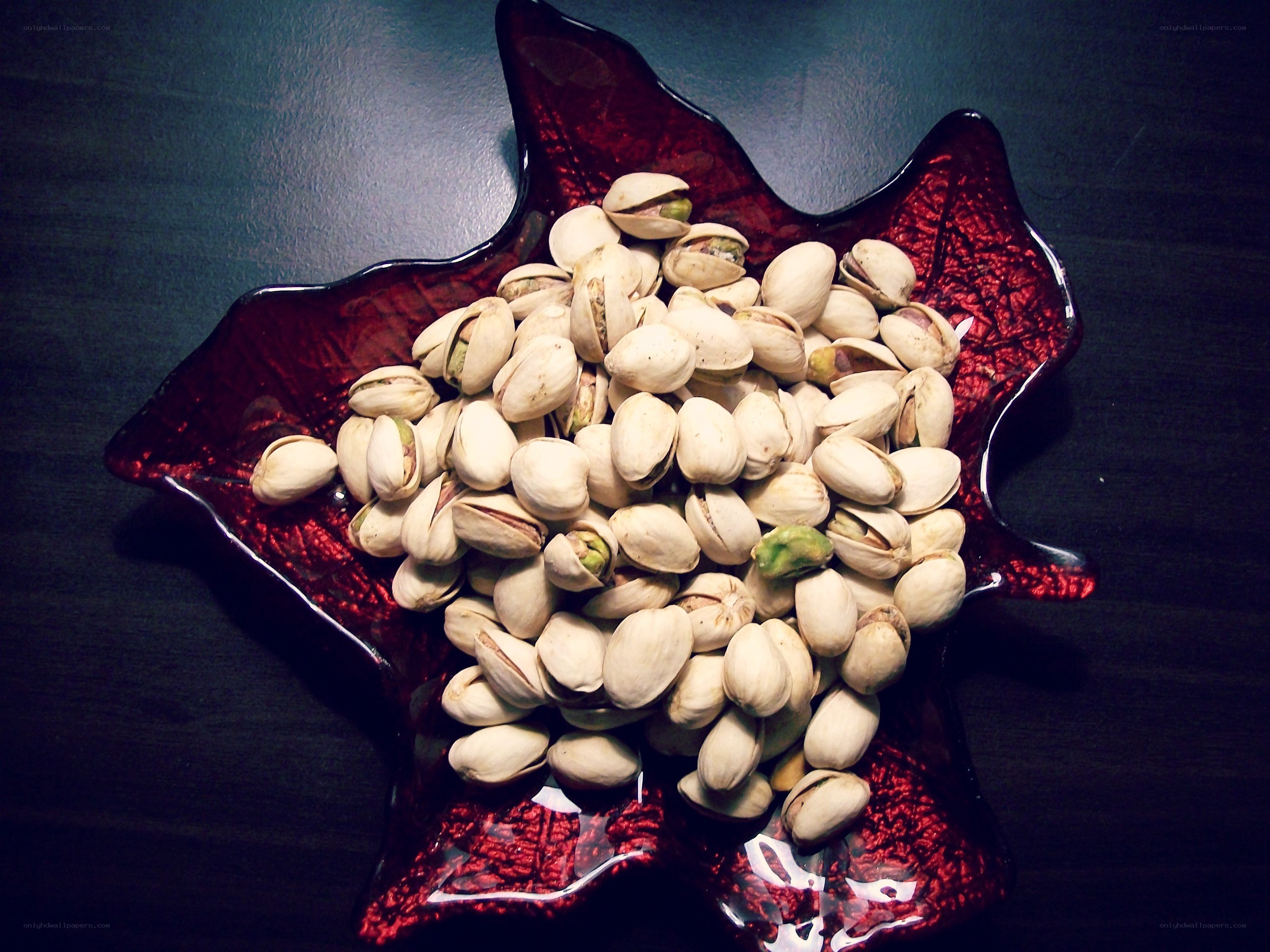 Pistachios in a red bowl