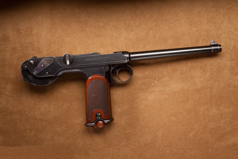 pistol on brown surface