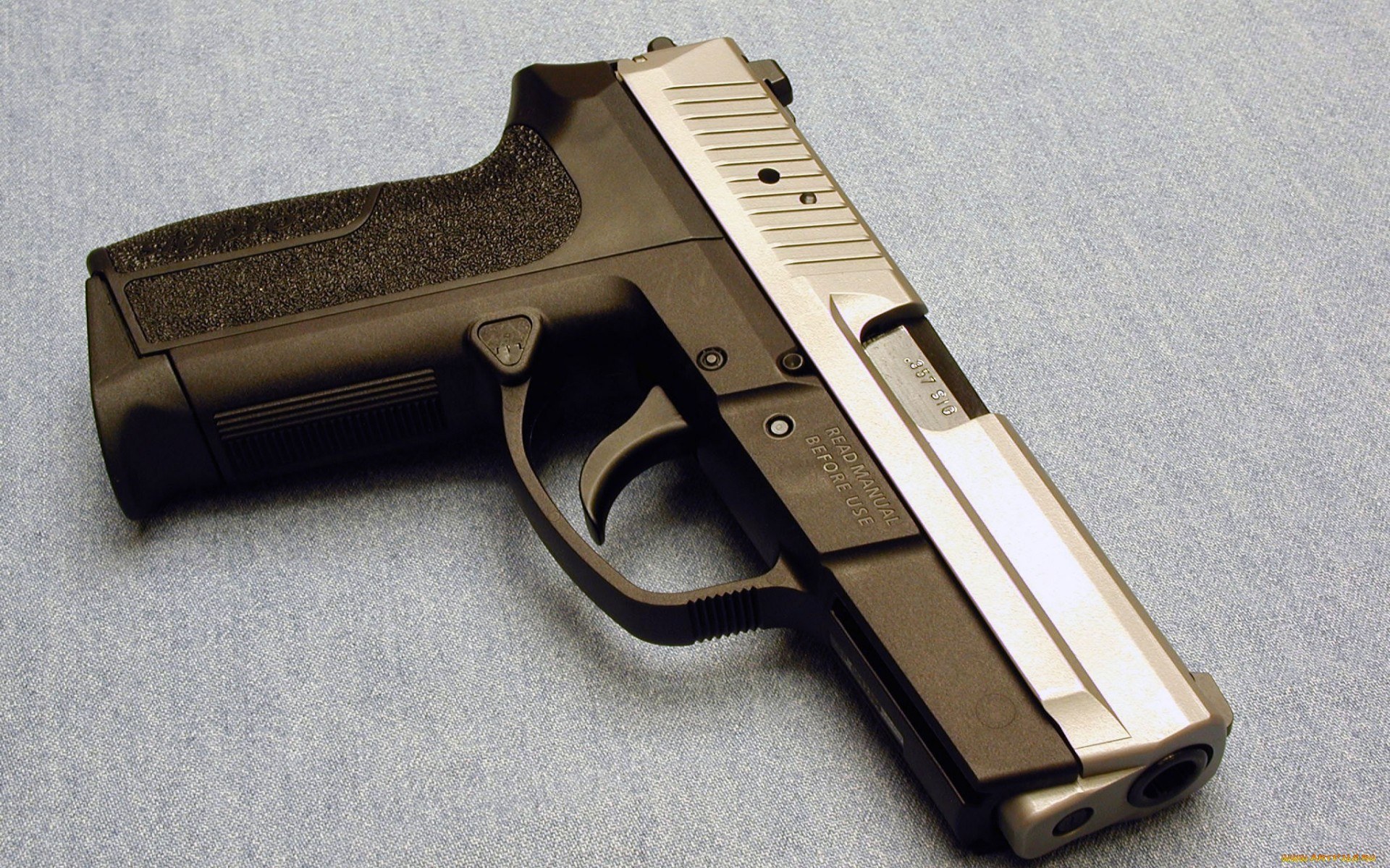 pistol on fabric surface