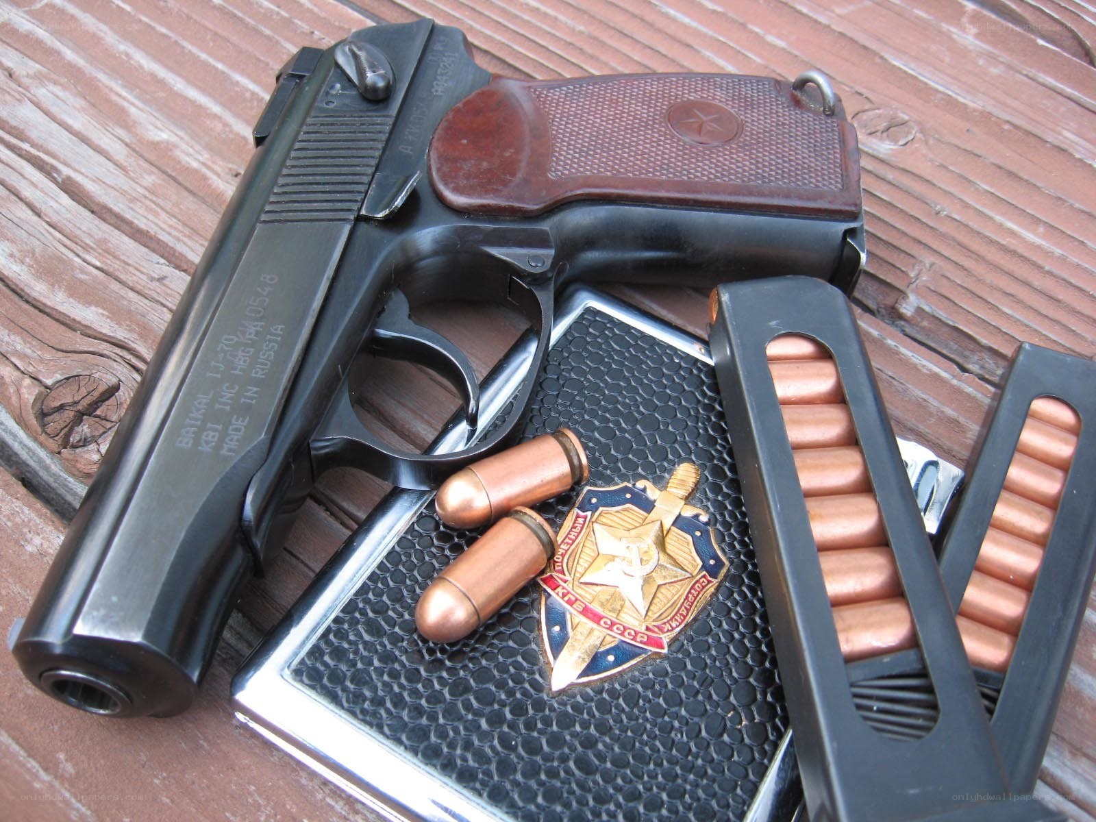 Pistol with ammunition and badge