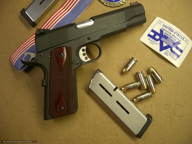 pistol with ammunition and membership card