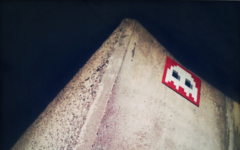pixel art alien on concrete