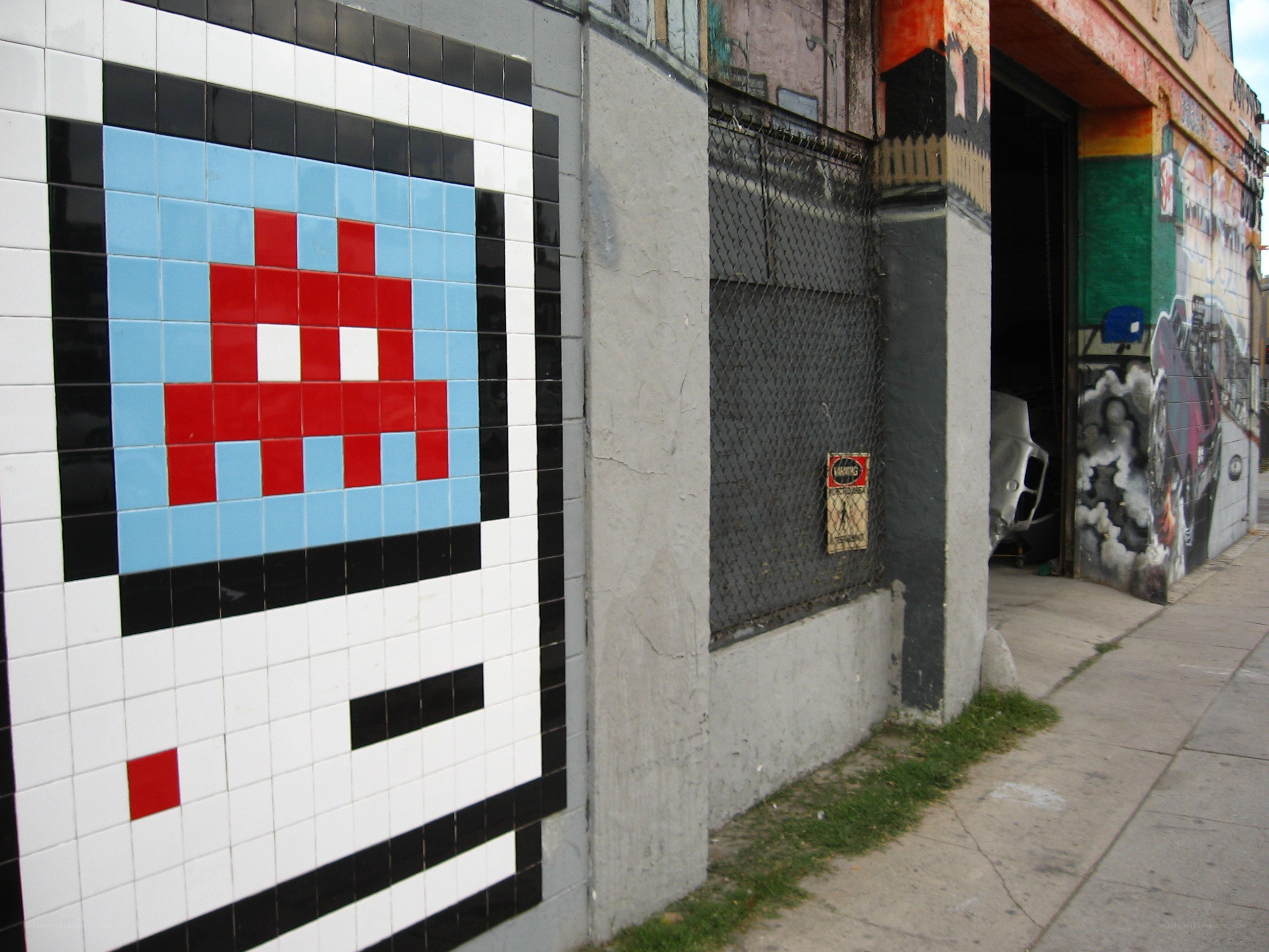 pixel art mural on city wall