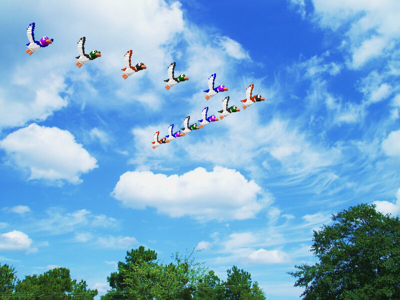 Pixelated birds in flight