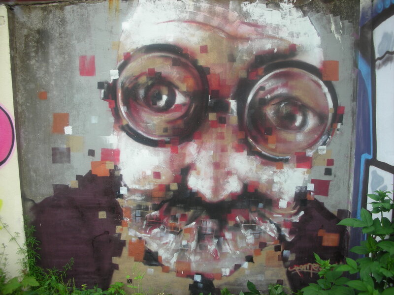 pixelated face graffiti mural