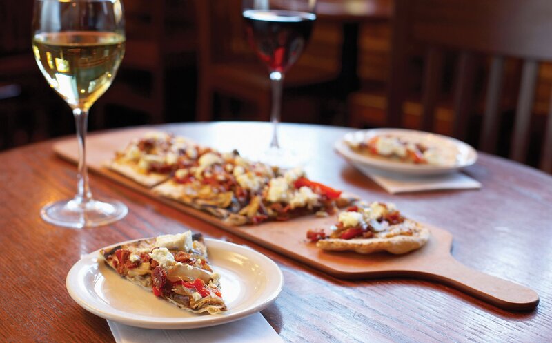Pizza and wine on a wooden table