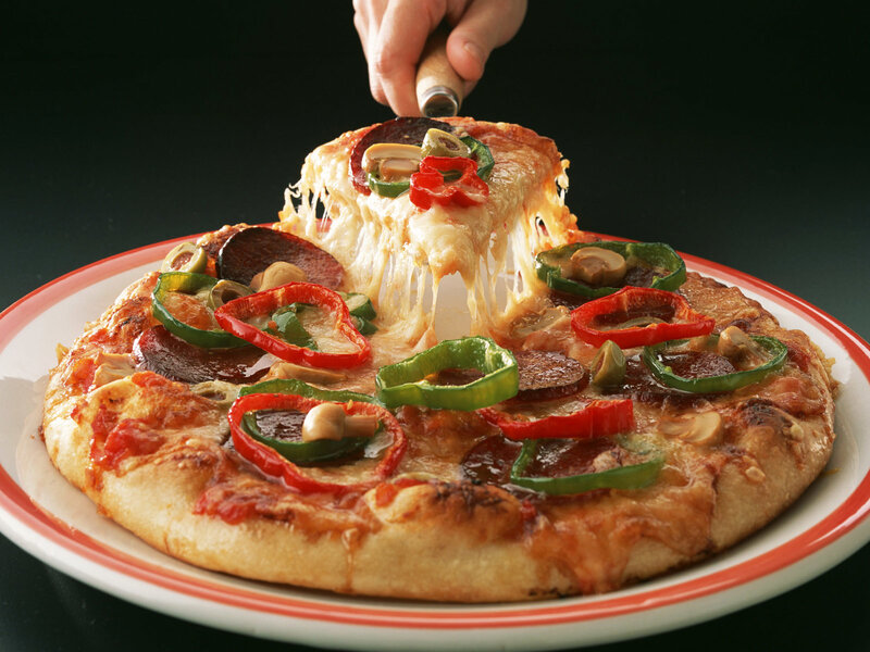 Pizza Being Lifted