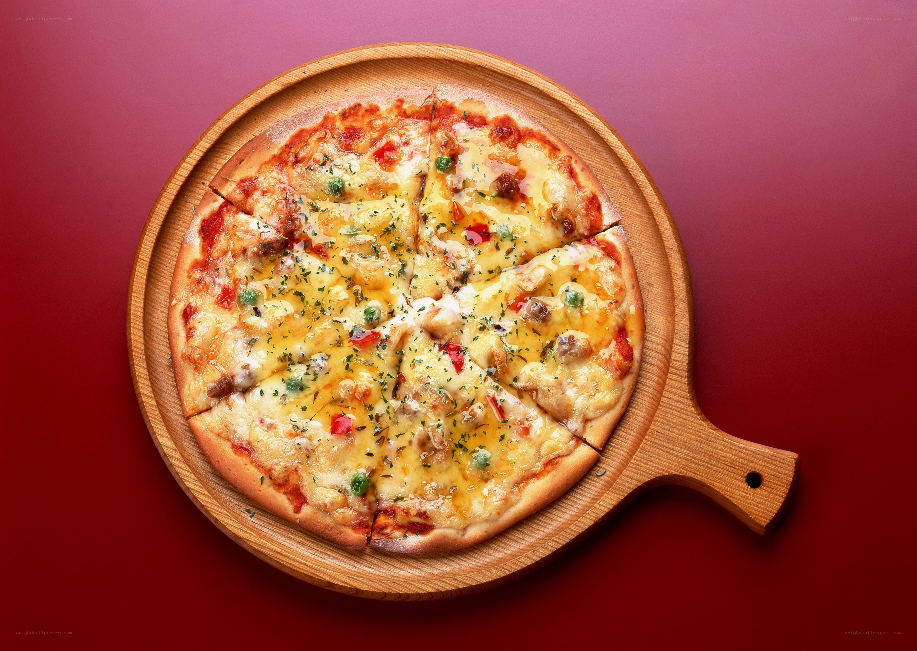 pizza on wooden serving board
