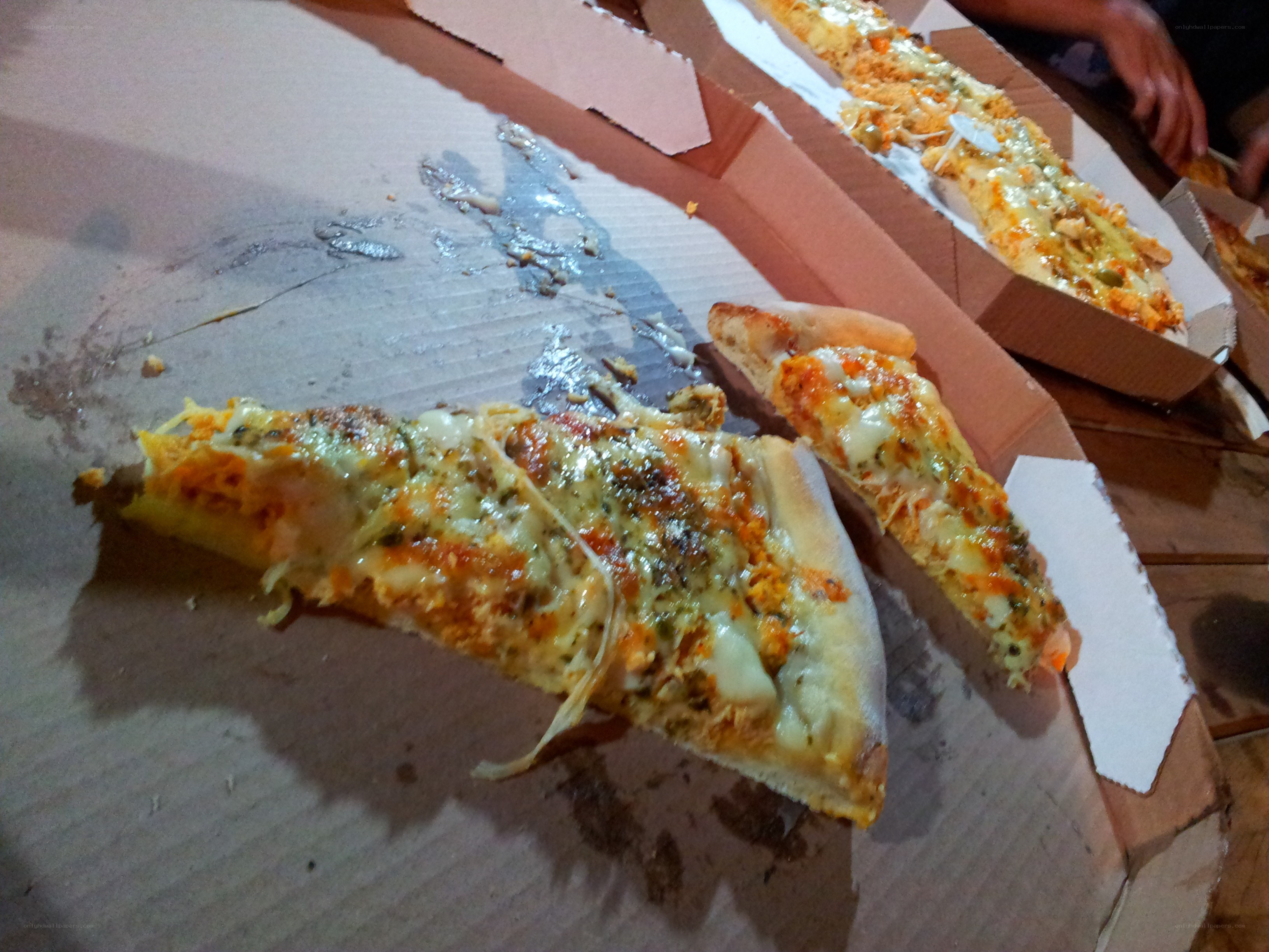 pizza slices in cardboard boxes