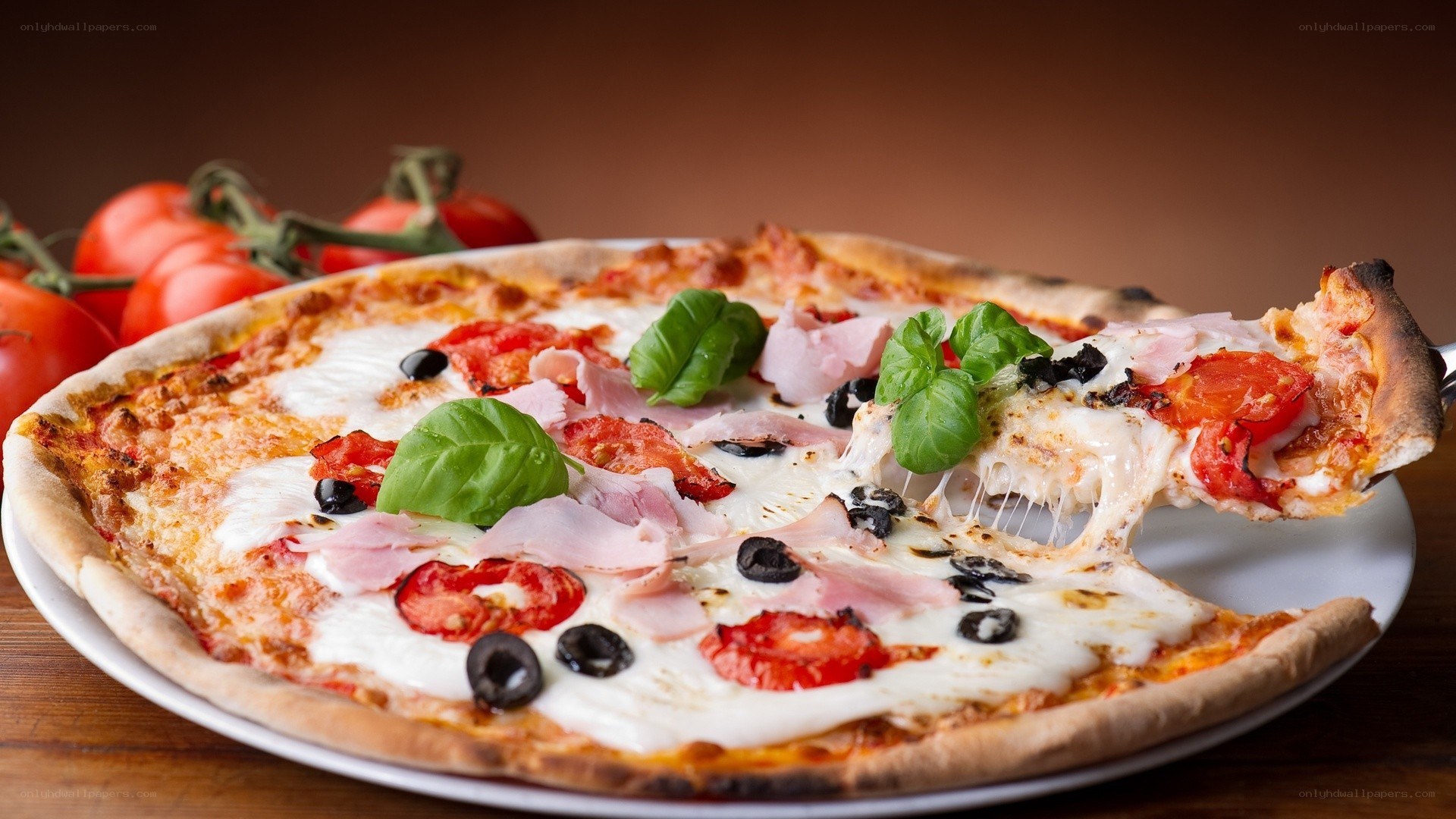 Pizza with ham and basil