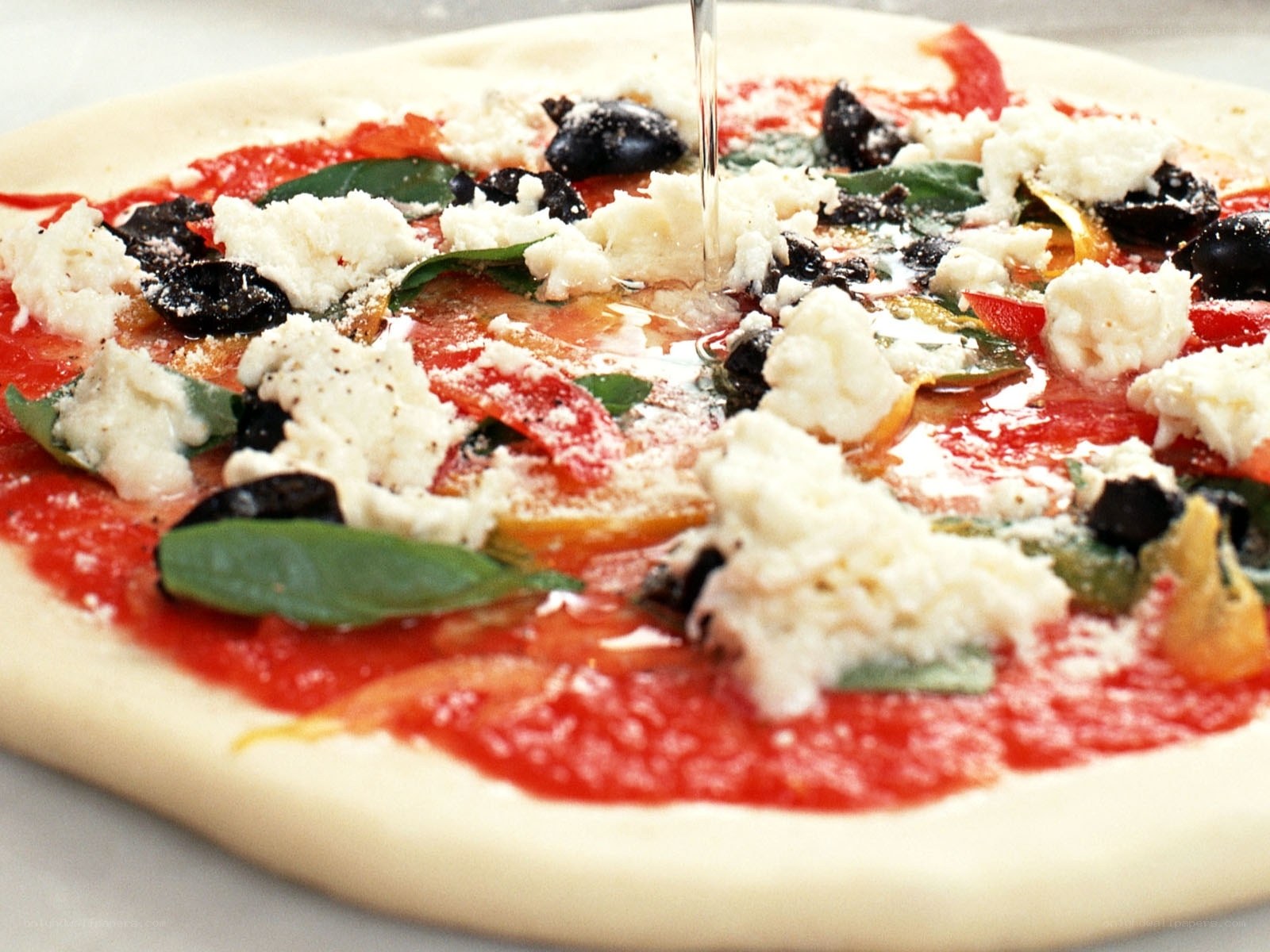 pizza with olive oil drizzle