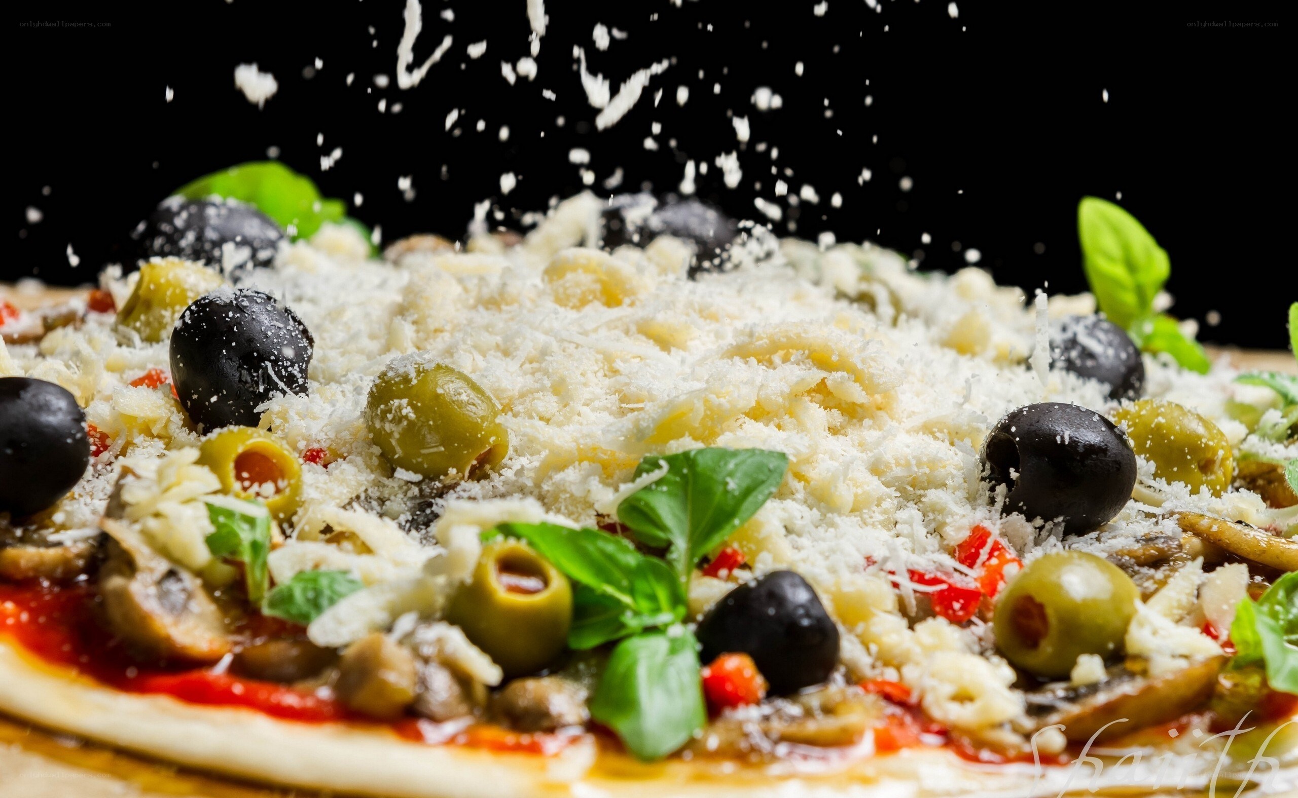 pizza with olives and basil
