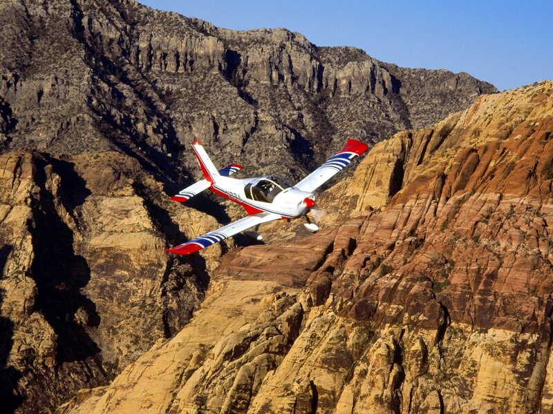 Plane flying over canyon