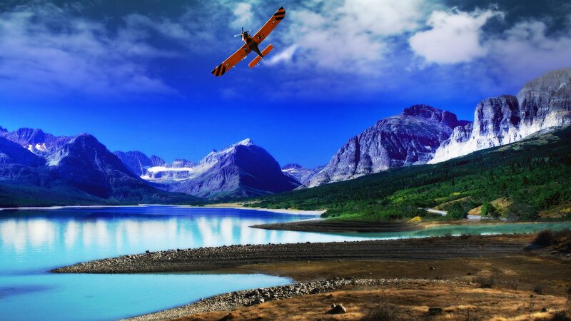 Plane over mountain lake