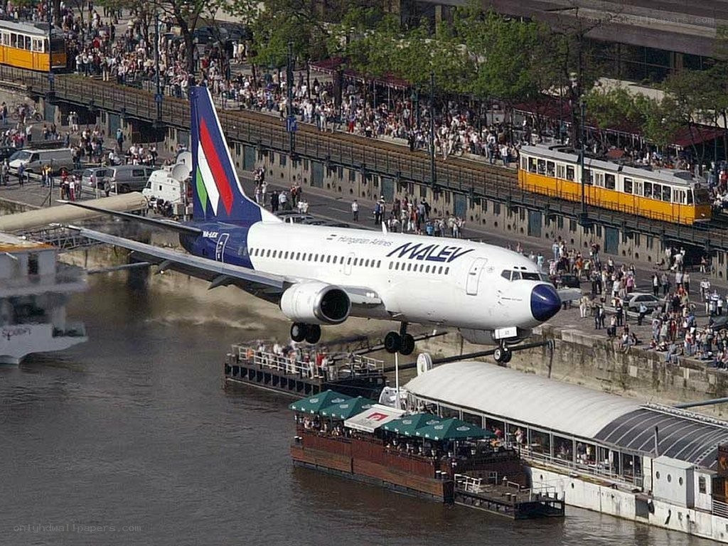Plane taking off over river