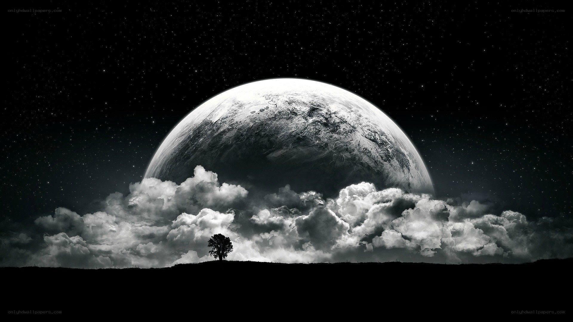 Planet over a lone tree