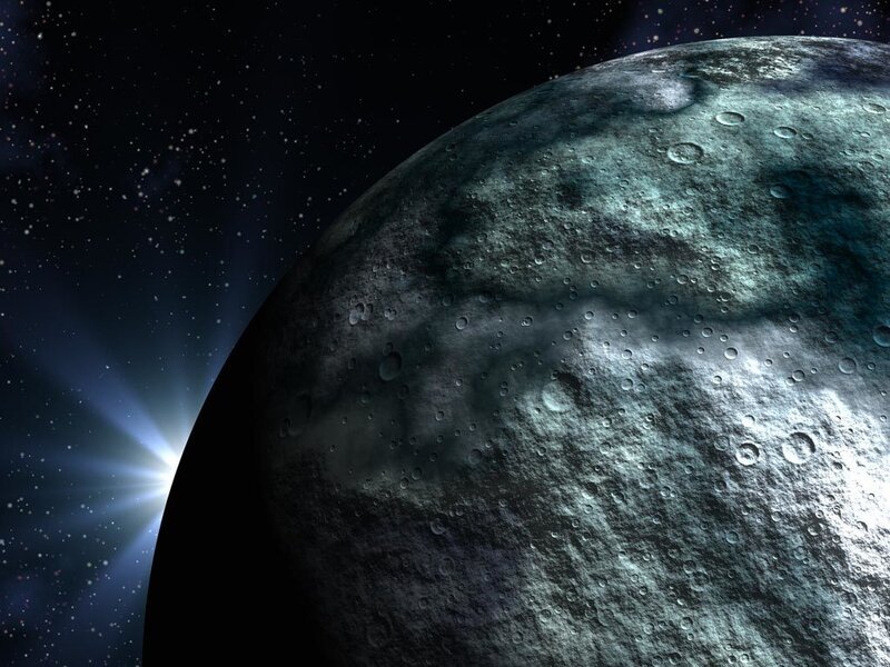 Planet with craters and starlight