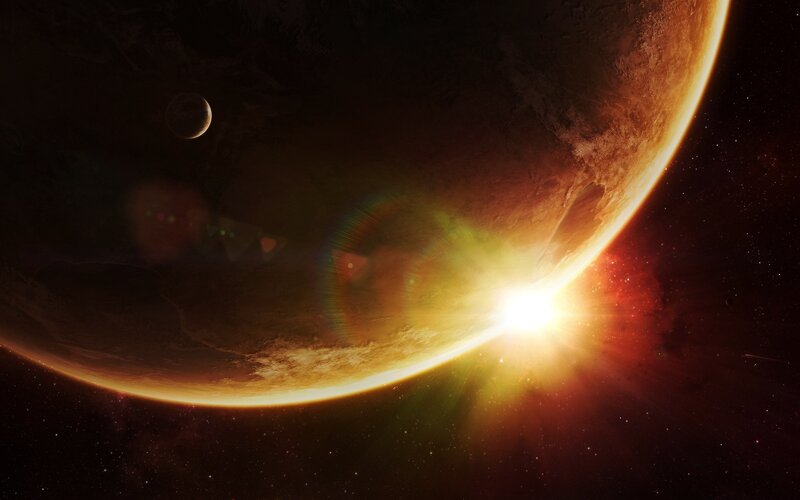 Planet with moon and sunrise