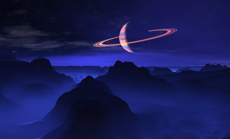 Planet with Rings Above Mountains