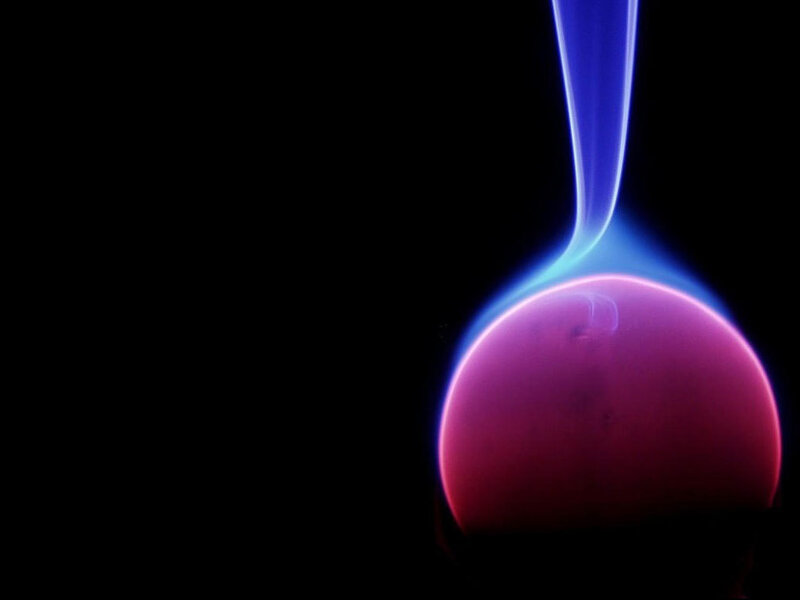 plasma ball glowing in darkness