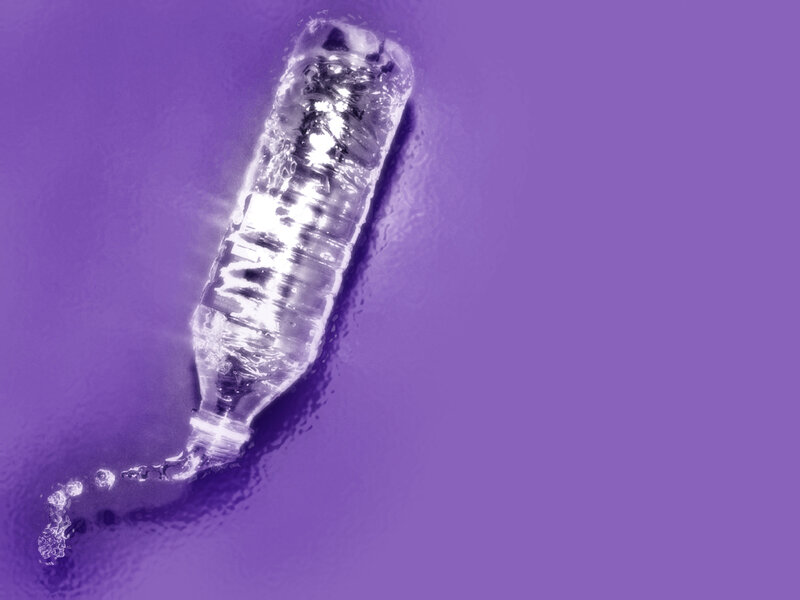 Plastic bottle floating in water
