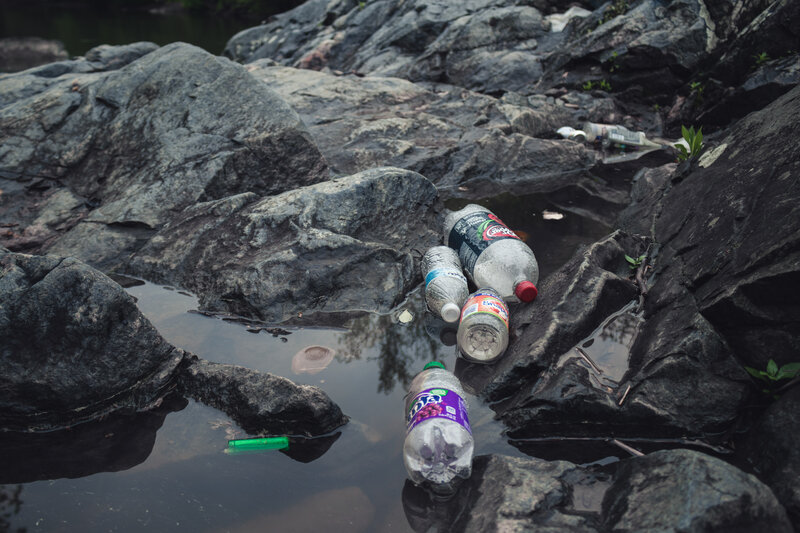 Plastic Bottles on Rocks