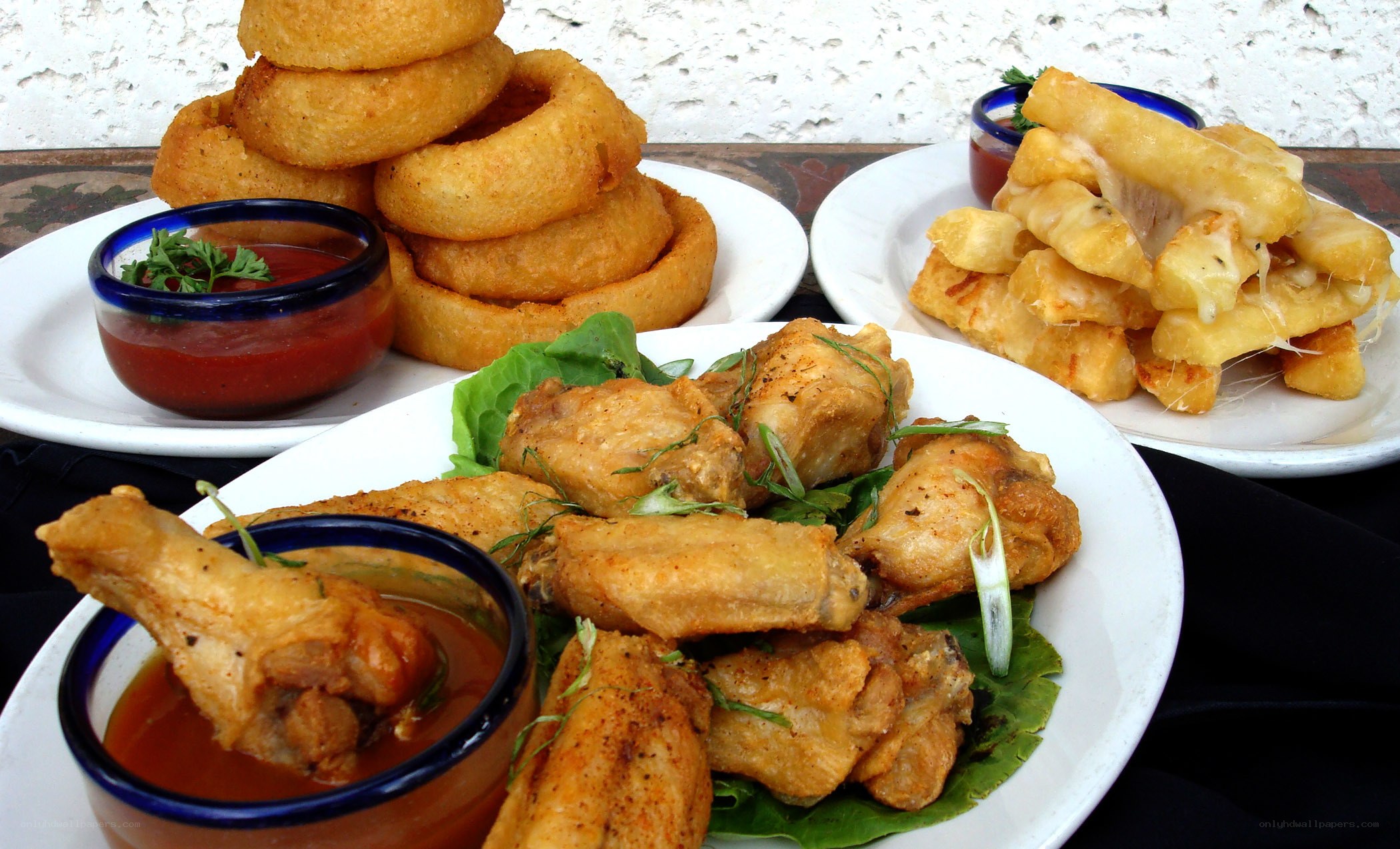 Plates of fried appetizers