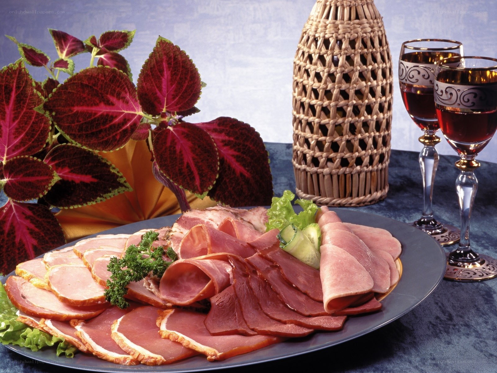 Platter of sliced meats with wine