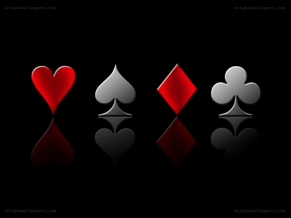 Playing card suits on black background