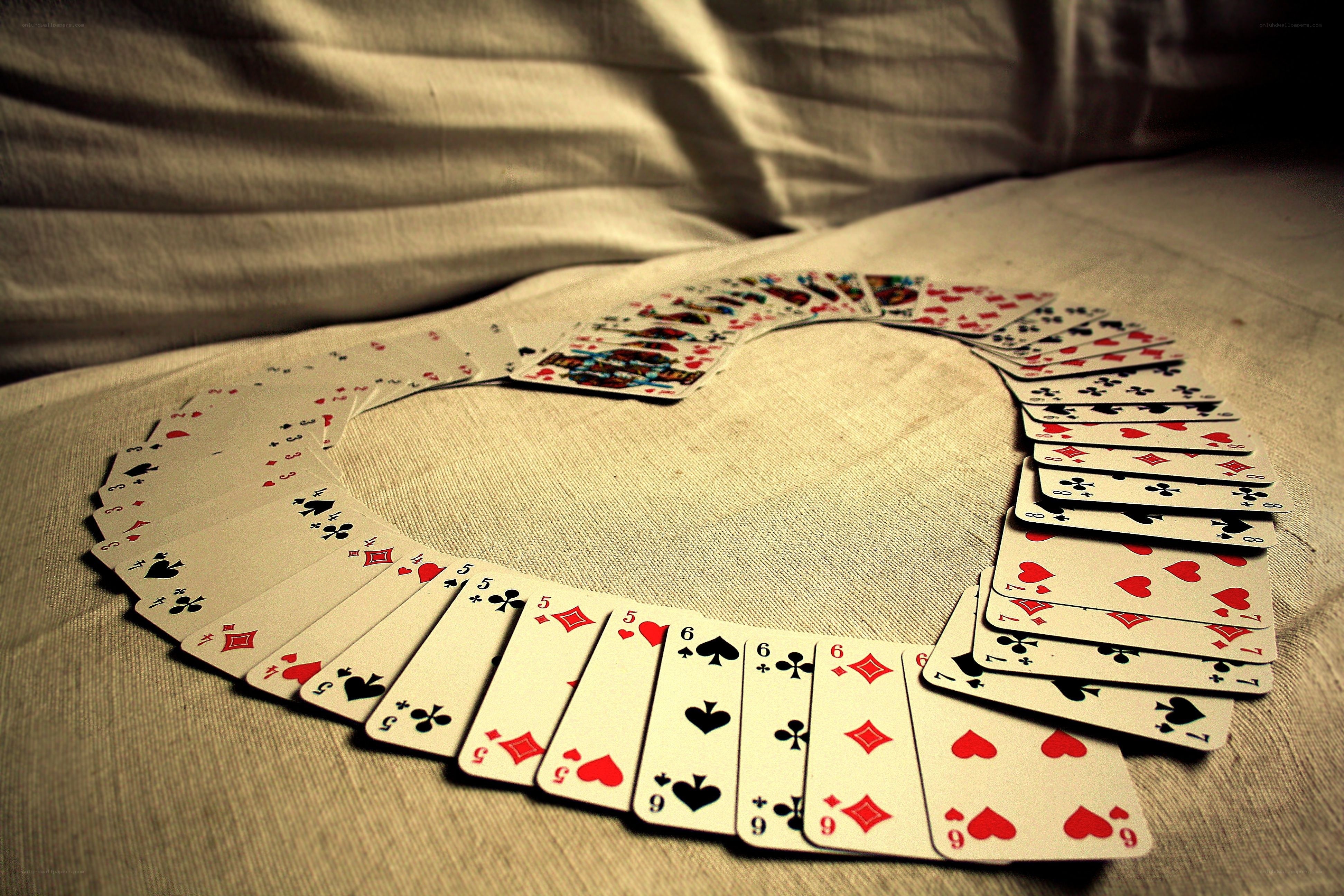 Playing cards arranged in a heart