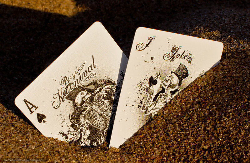 Playing cards in the sand