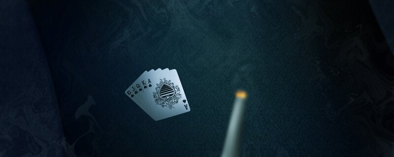 playing cards on dark surface
