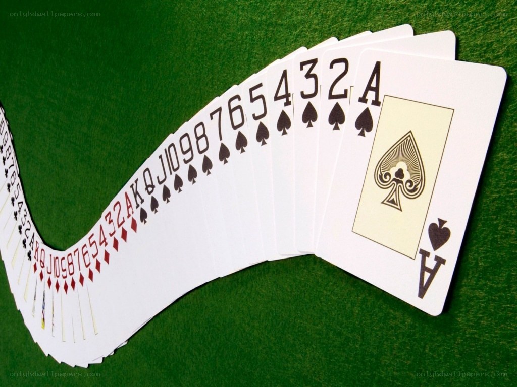 Playing cards on green felt