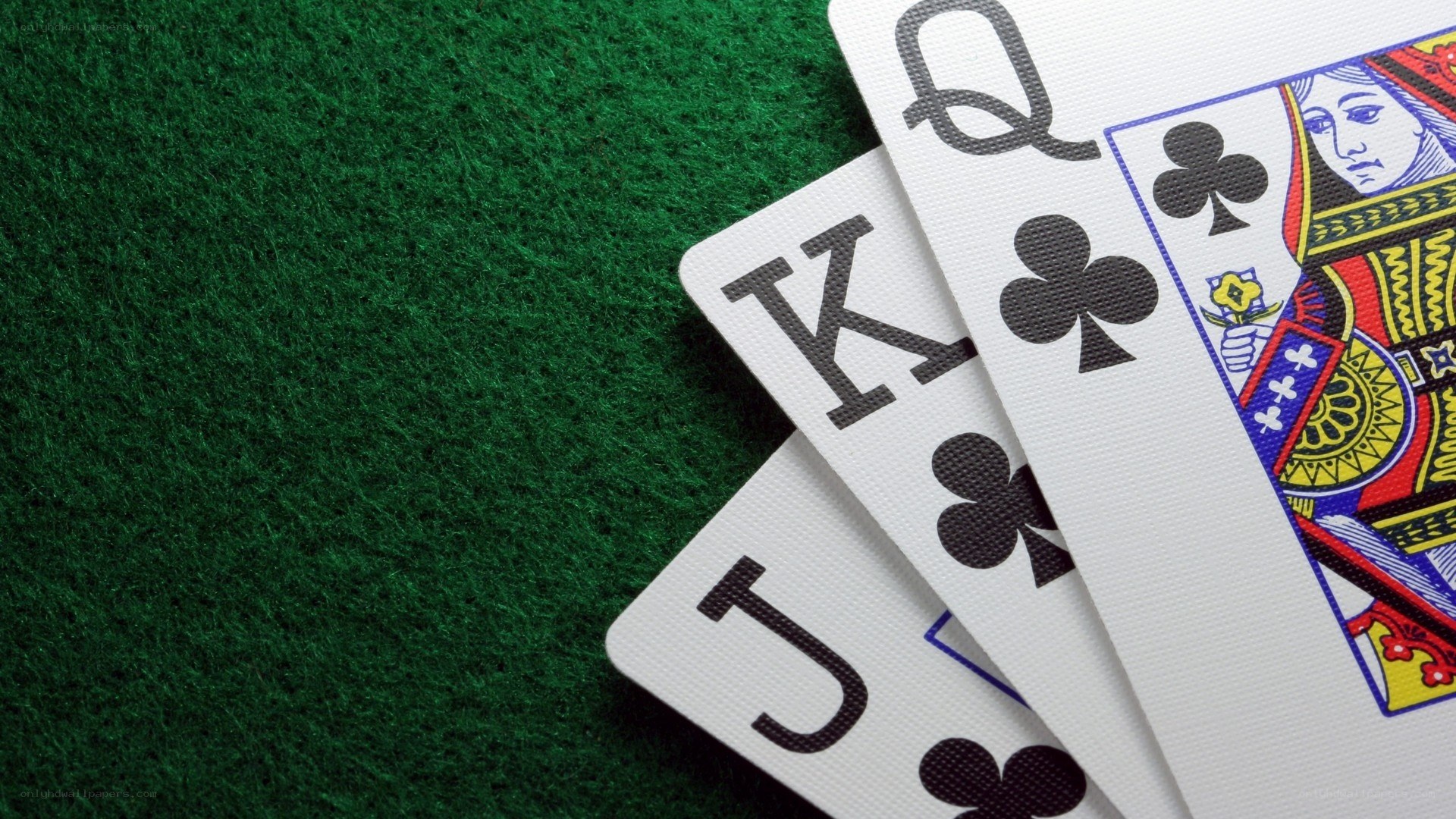 playing cards on green felt