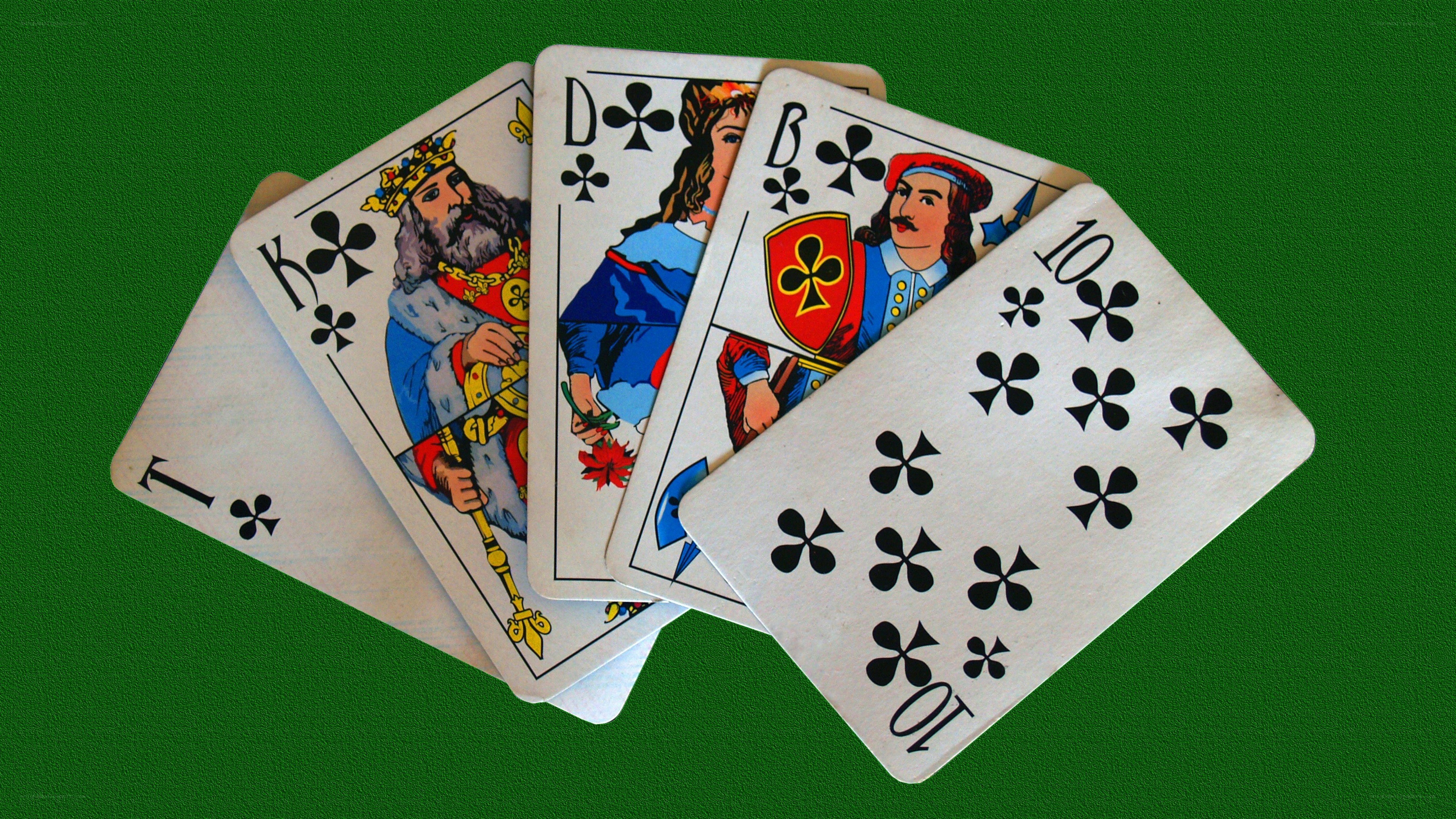 playing cards on green felt