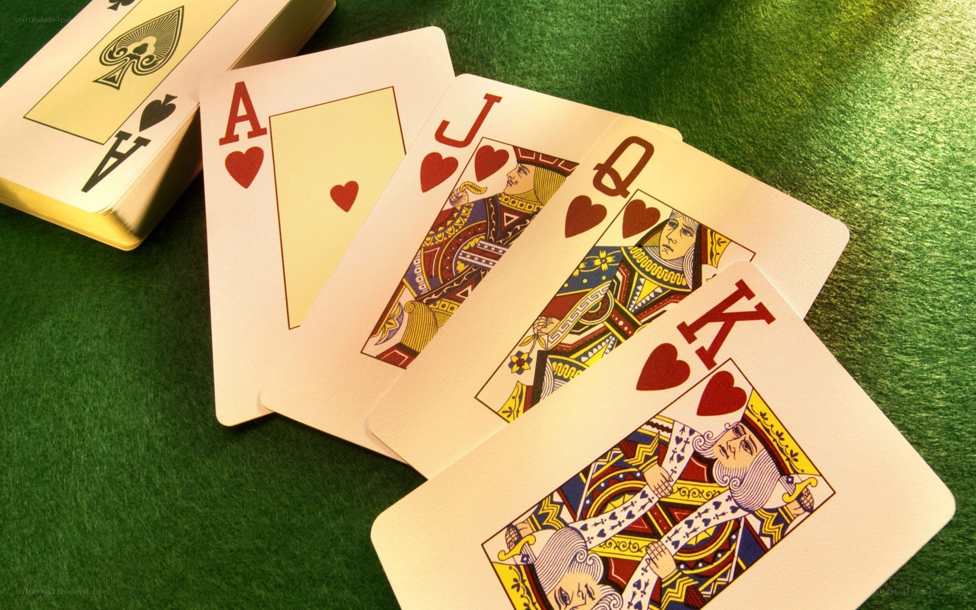 playing cards on green felt