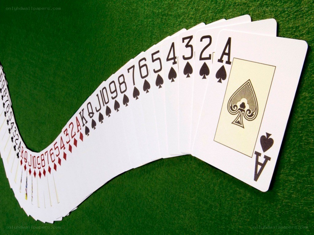 playing cards on green felt