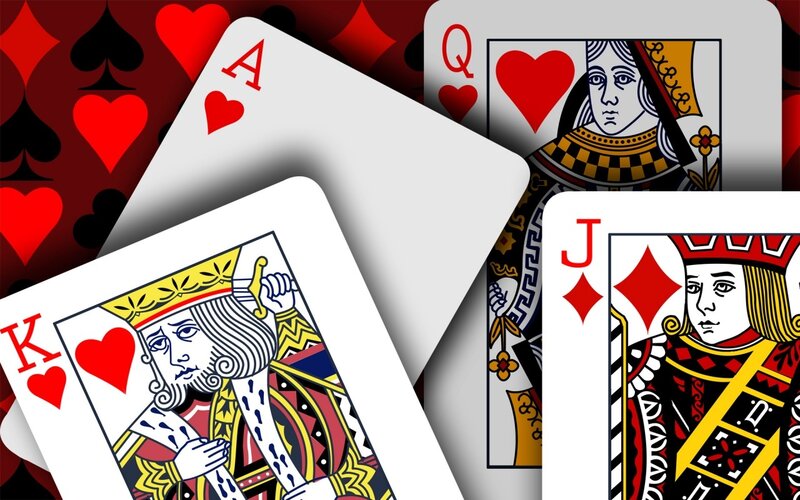 playing cards on patterned background
