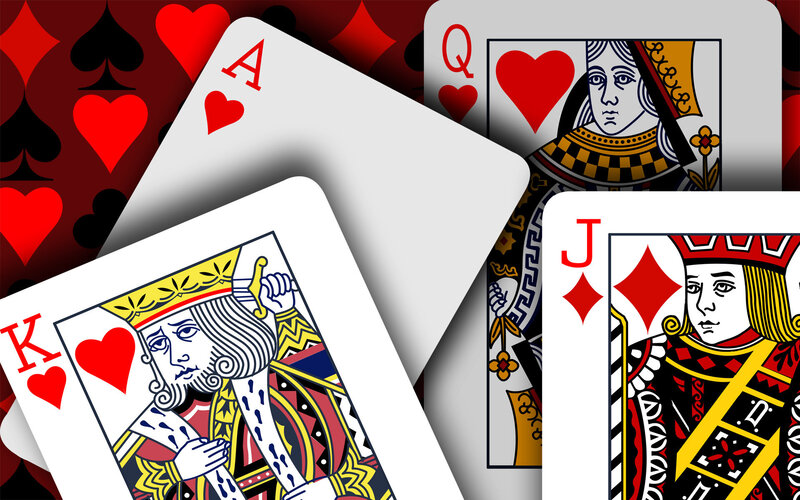 Playing Cards on Patterned Background — Red