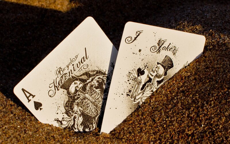 Playing cards on sand
