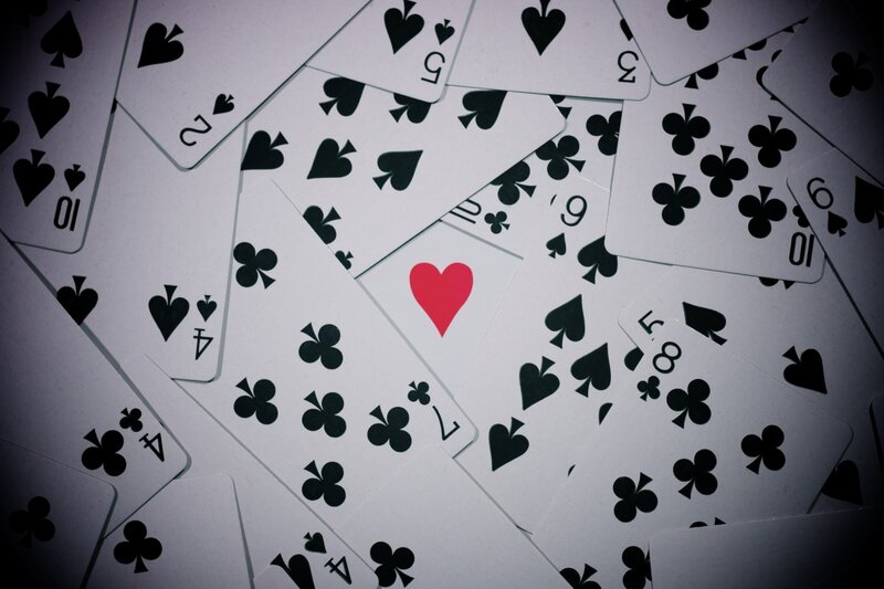 playing cards scattered on surface