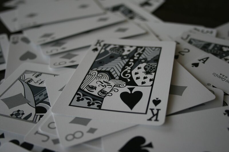 playing cards scattered on table