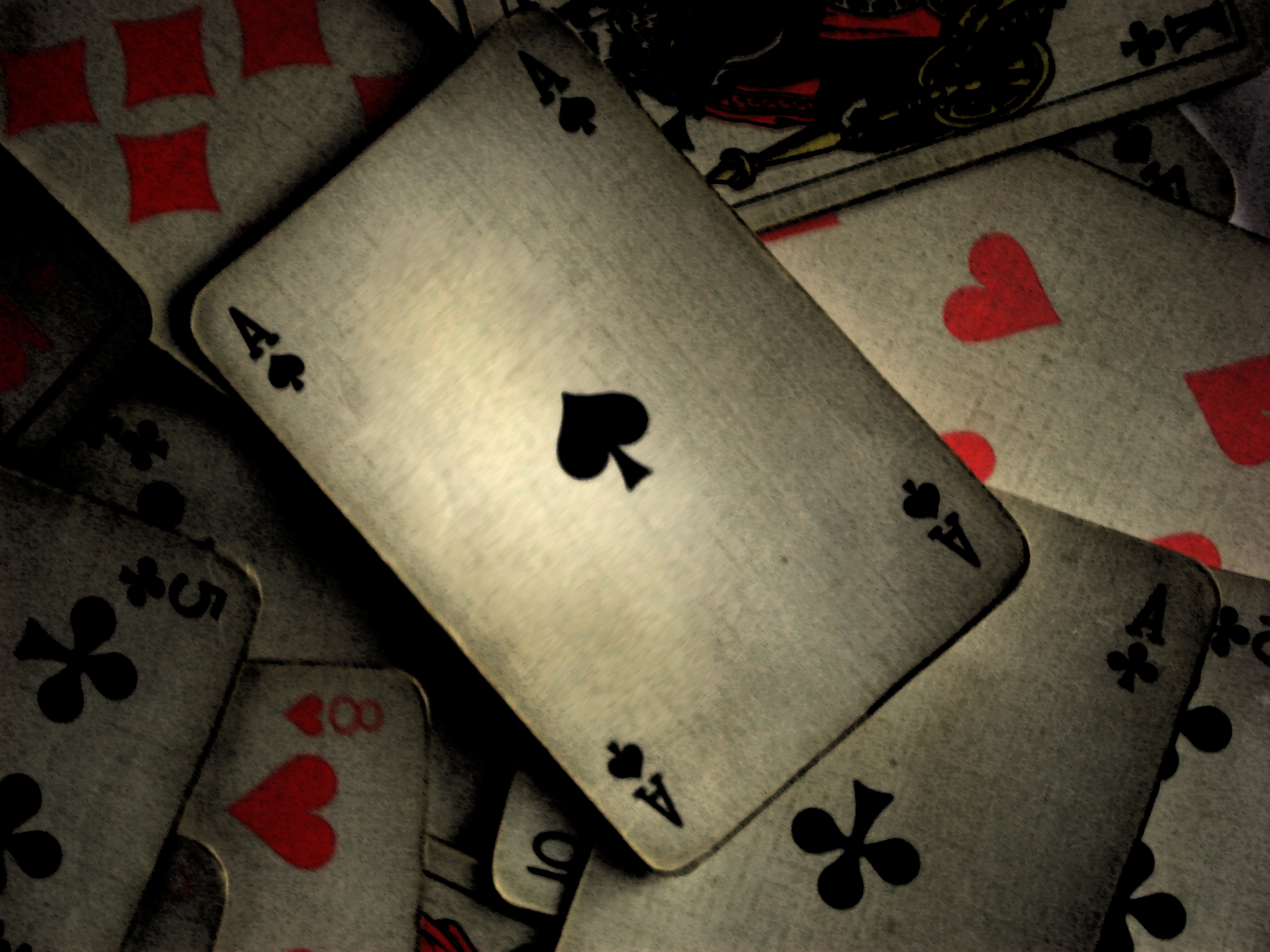 playing cards scattered on table