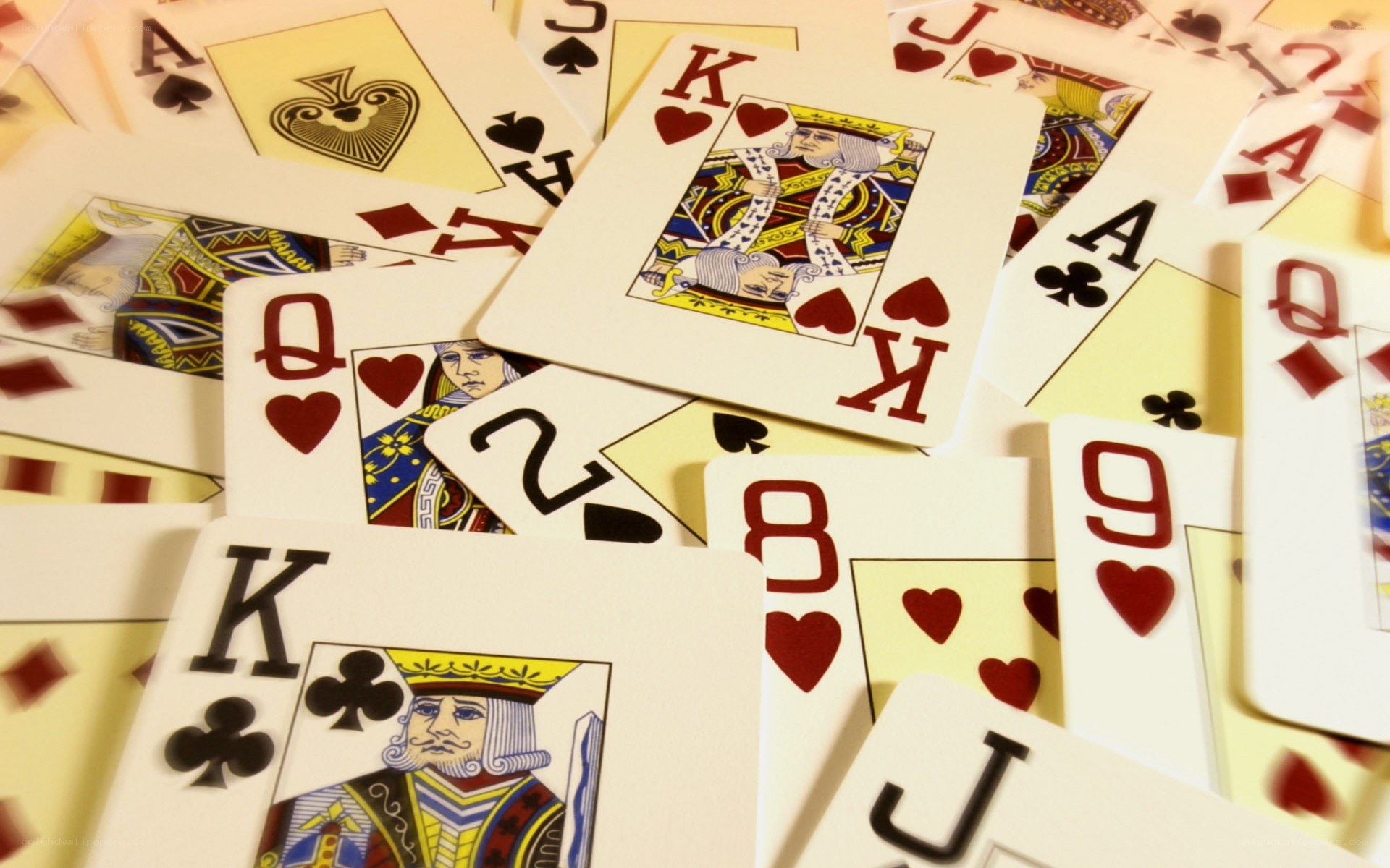 playing cards scattered on table