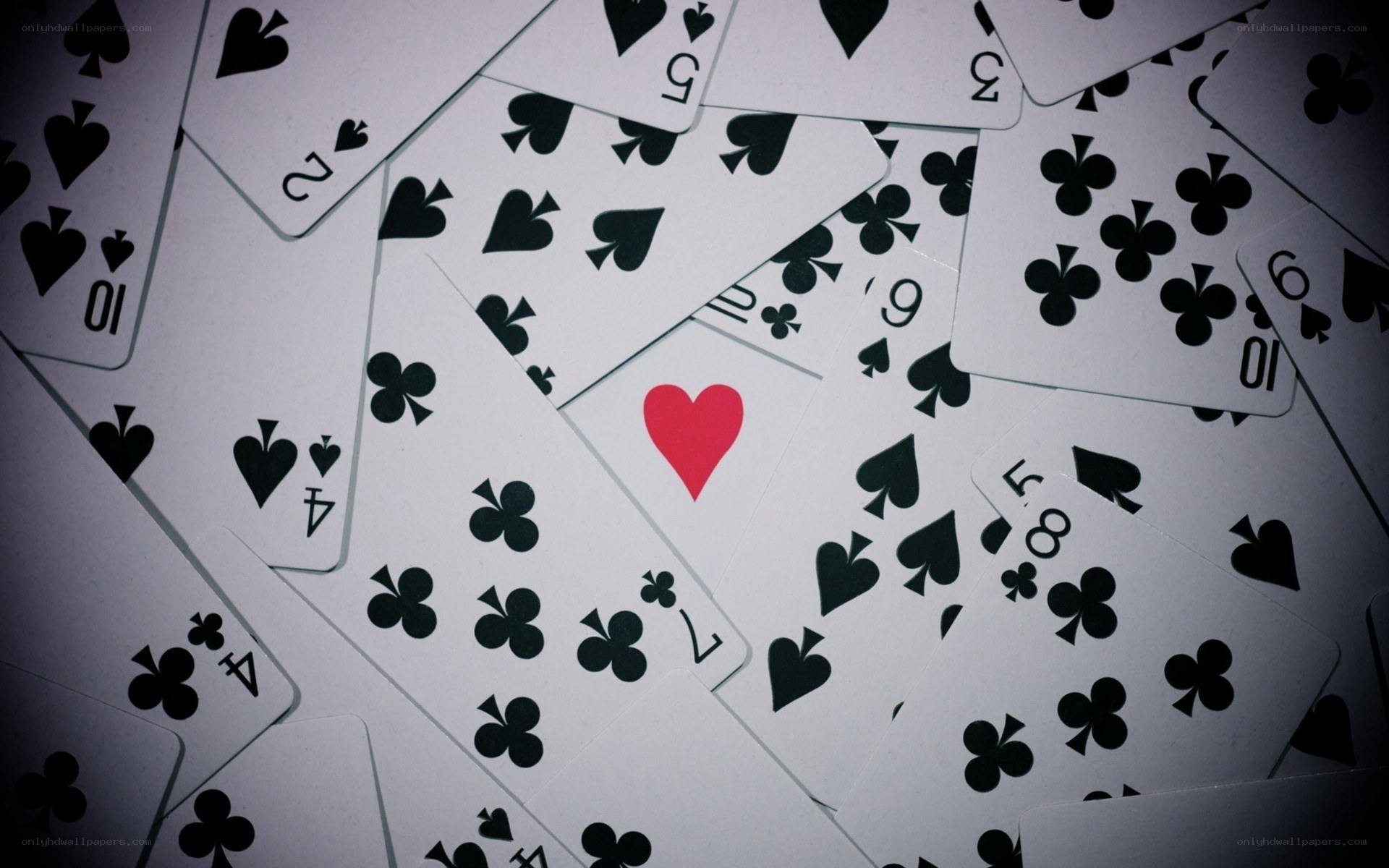 playing cards scattered on table