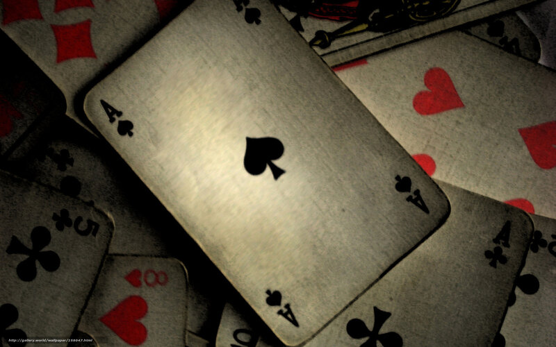 playing cards scattered on table