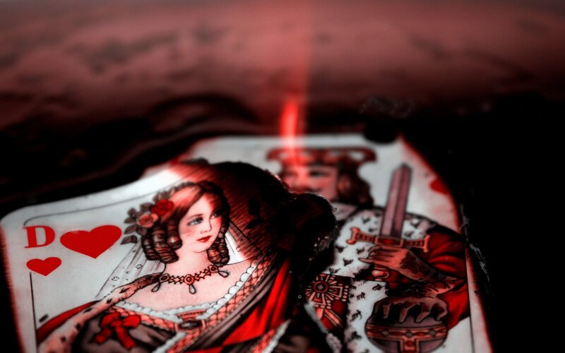 playing cards with red lighting