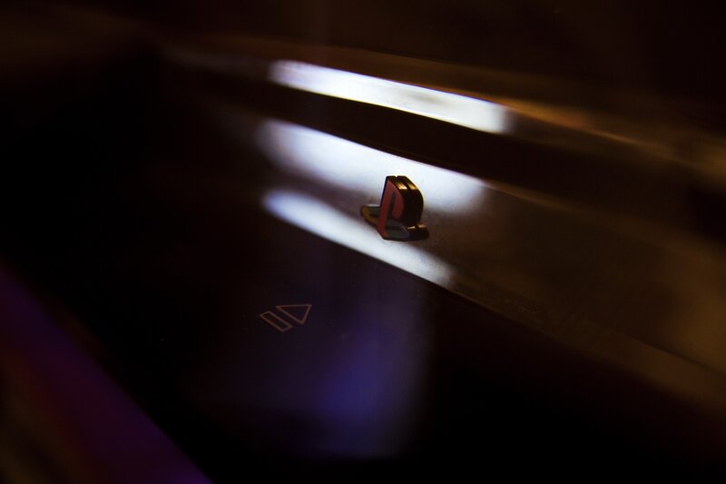 PlayStation logo in dim light