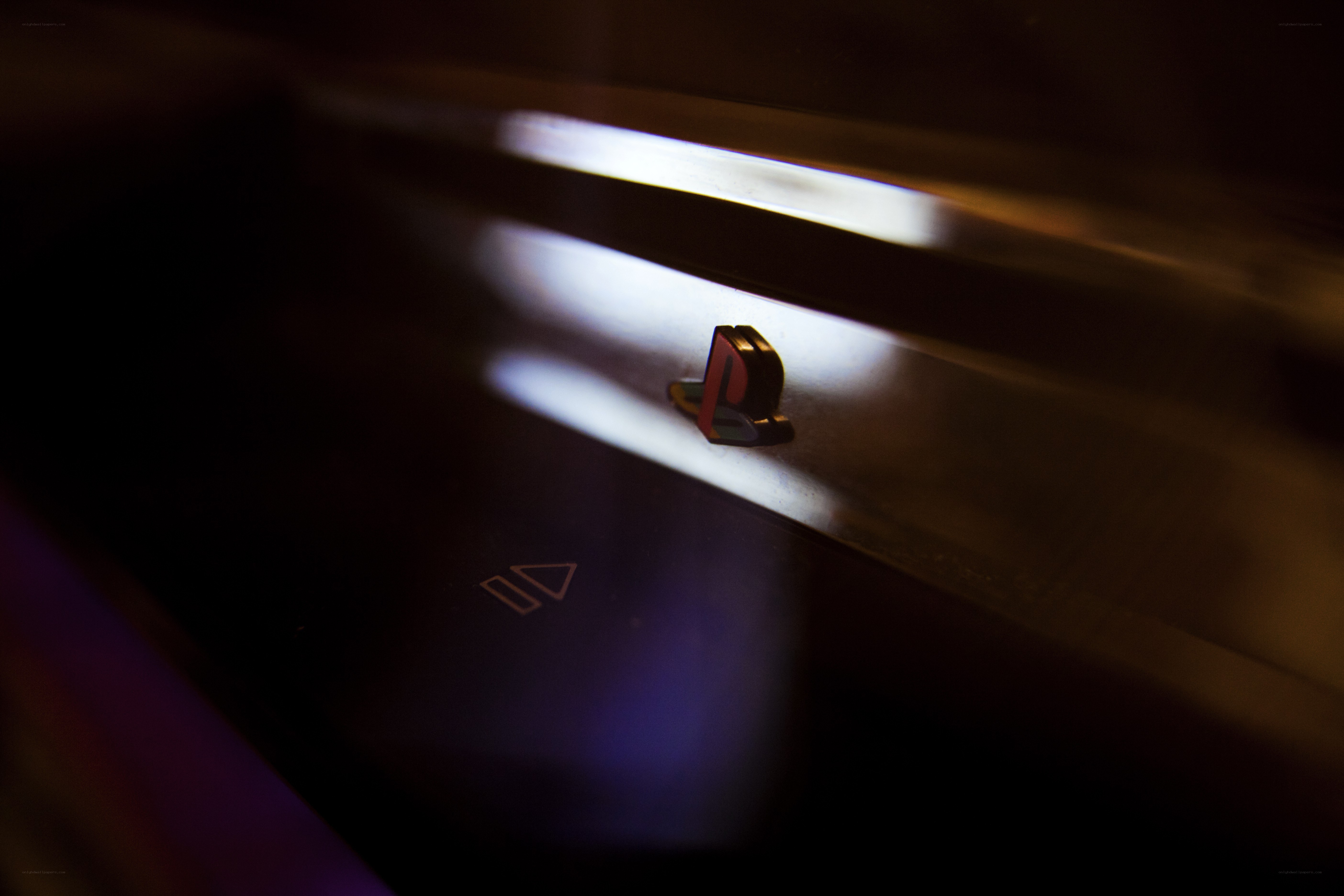 PlayStation logo in dim light
