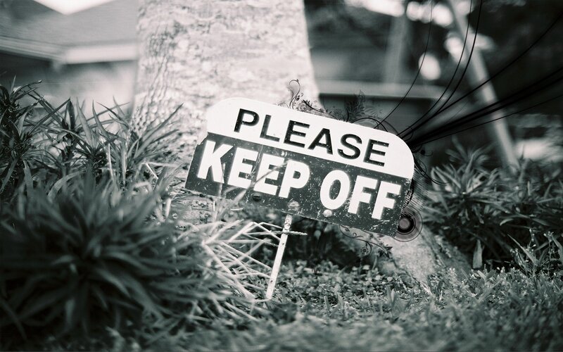 Please Keep Off sign in garden